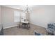 Carpeted bedroom with stylish light fixture and desk at 1934 Acorn Ln, Dacula, GA 30019