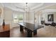 Bright dining area with tray ceilings, wainscoting, and contemporary decor at 1934 Acorn Ln, Dacula, GA 30019