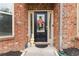 Welcoming front door adorned with a floral wreath and charming decorations at 1934 Acorn Ln, Dacula, GA 30019
