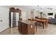 Beautiful kitchen with a granite island, stainless steel appliances, and adjoining dining area at 1934 Acorn Ln, Dacula, GA 30019