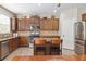 The kitchen has a breakfast bar, granite countertops, and stainless steel appliances at 1934 Acorn Ln, Dacula, GA 30019