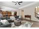 Open living area featuring a comfortable sectional sofa and an open kitchen at 1934 Acorn Ln, Dacula, GA 30019