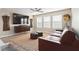 Relaxing living room with large TV, stylish furniture, ceiling fan, and large windows at 1934 Acorn Ln, Dacula, GA 30019