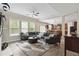 Cozy living room featuring a large sectional sofa and an open floor plan at 1934 Acorn Ln, Dacula, GA 30019