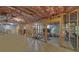 Unfinished basement space with exposed insulation, framing and access to exterior at 3020 Crooked Stick Dr, Cumming, GA 30041