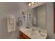 Bathroom featuring a modern sink and a large mirror with decorative accents at 3020 Crooked Stick Dr, Cumming, GA 30041