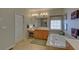 Bright bathroom featuring dual sinks, white cabinets, separate tub, and tiled floors at 3020 Crooked Stick Dr, Cumming, GA 30041