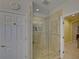 Bathroom featuring a glass-enclosed shower, tile flooring, and white walls at 3020 Crooked Stick Dr, Cumming, GA 30041