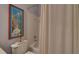 Bathroom with a shower/tub combo, toilet, and decorartive artwork at 3020 Crooked Stick Dr, Cumming, GA 30041
