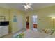 Bedroom with a twin bed and seating area, plus doorway to bath and hall at 3020 Crooked Stick Dr, Cumming, GA 30041