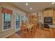 Charming dining area with table, chairs, and natural light streaming through the windows at 3020 Crooked Stick Dr, Cumming, GA 30041