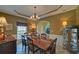 Stylish dining room featuring elegant lighting, wood furniture, and crown molding, great for gatherings at 3020 Crooked Stick Dr, Cumming, GA 30041