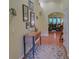 Bright foyer with hardwood floors, decorated console table, and artwork, creating a warm entry at 3020 Crooked Stick Dr, Cumming, GA 30041