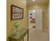 Hallway with green furnishings and an open doorway to the bathroom at 3020 Crooked Stick Dr, Cumming, GA 30041