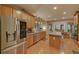 Bright kitchen featuring stainless steel appliances, island, and ample counter space for cooking at 3020 Crooked Stick Dr, Cumming, GA 30041
