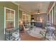 Comfortable screened-in porch with ceiling fan, and outdoor kitchen with a grill at 3020 Crooked Stick Dr, Cumming, GA 30041