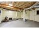 Unfinished basement with visible insulation, concrete walls, and ample space for storage or renovation at 3020 Parkridge Ne Dr, Brookhaven, GA 30319