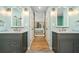 Elegant bathroom featuring dual vanities and tile flooring at 3020 Parkridge Ne Dr, Brookhaven, GA 30319
