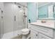 Modern bathroom featuring a glass-enclosed shower and sleek white vanity at 3020 Parkridge Ne Dr, Brookhaven, GA 30319