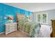Bright bedroom featuring unique accent wall, french doors, and a view to the outside at 3020 Parkridge Ne Dr, Brookhaven, GA 30319