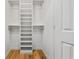Spacious closet featuring custom white shelving and drawers to maximize storage space at 3020 Parkridge Ne Dr, Brookhaven, GA 30319