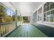 Spacious covered porch with a swing, ideal for outdoor relaxation and enjoying the surroundings at 3020 Parkridge Ne Dr, Brookhaven, GA 30319