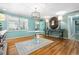 Bright dining room featuring hardwood floors, a unique table, and ample natural light at 3020 Parkridge Ne Dr, Brookhaven, GA 30319