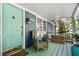 Inviting front porch with a colorful door, cozy seating, and a warm welcome to the home at 3020 Parkridge Ne Dr, Brookhaven, GA 30319