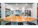 Stylish kitchen with a wooden breakfast bar, white cabinetry, stainless steel appliances, and modern fixtures at 3020 Parkridge Ne Dr, Brookhaven, GA 30319