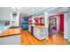 Spacious kitchen showcasing wood floors, white cabinetry, and views into the dining area at 3020 Parkridge Ne Dr, Brookhaven, GA 30319