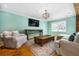 Relaxing living room with hardwood floors, a large rug, and comfortable seating, perfect for Gathering gatherings at 3020 Parkridge Ne Dr, Brookhaven, GA 30319