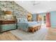 Airy main bedroom featuring wallpaper, wood floors, and natural light at 3020 Parkridge Ne Dr, Brookhaven, GA 30319
