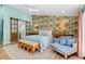 Serene main bedroom with floral wallpaper, hardwood floors, and a sitting area at 3020 Parkridge Ne Dr, Brookhaven, GA 30319