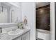 Well-appointed bathroom with vanity, granite countertop, and tiled shower/tub combo at 4971 Sharp Way, Duluth, GA 30096