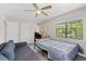 Bedroom featuring a window, ceiling fan, neutral paint and carpet at 4971 Sharp Way, Duluth, GA 30096