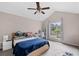 Comfortable bedroom with vaulted ceilings and ample natural light from a large window at 4971 Sharp Way, Duluth, GA 30096