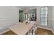 Open dining area with wood floors flowing to the living spaces at 4971 Sharp Way, Duluth, GA 30096