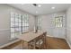 Bright dining room features hardwood floors and a large window providing natural light at 4971 Sharp Way, Duluth, GA 30096