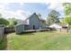 Exterior view of the backyard features a deck, green lawn and neutral siding at 4971 Sharp Way, Duluth, GA 30096