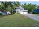 Charming two-story home featuring a two-car garage, second story balcony, and well-manicured front lawn at 4971 Sharp Way, Duluth, GA 30096