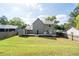 Back of house with a deck and spacious backyard at 4971 Sharp Way, Duluth, GA 30096