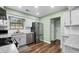 Updated kitchen with stainless steel appliances and wood-look flooring at 4971 Sharp Way, Duluth, GA 30096