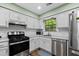 Modern kitchen with white cabinets, stainless appliances, and subway tile backsplash at 4971 Sharp Way, Duluth, GA 30096