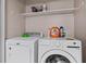 Laundry room features a white washing machine and dryer at 4971 Sharp Way, Duluth, GA 30096