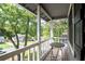 View from the porch surrounded by trees and overlooking the street at 4971 Sharp Way, Duluth, GA 30096
