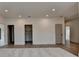 Spacious basement area with neutral tones, hardwood floors, and recessed lighting throughout at 11305 Knollwood Bend, Johns Creek, GA 30097