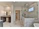 Bright bathroom boasting vanity, glass shower, walk-in closet, and stylish marble flooring at 11305 Knollwood Bend, Johns Creek, GA 30097