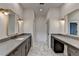 Bathroom with double vanity, modern sinks, marble floor, and gold-framed mirrors at 11305 Knollwood Bend, Johns Creek, GA 30097