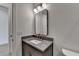 Modern bathroom with sleek vanity, matte black hardware, and frameless mirror at 11305 Knollwood Bend, Johns Creek, GA 30097