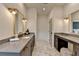 Bright bathroom features double vanity with elegant fixtures and marble flooring at 11305 Knollwood Bend, Johns Creek, GA 30097